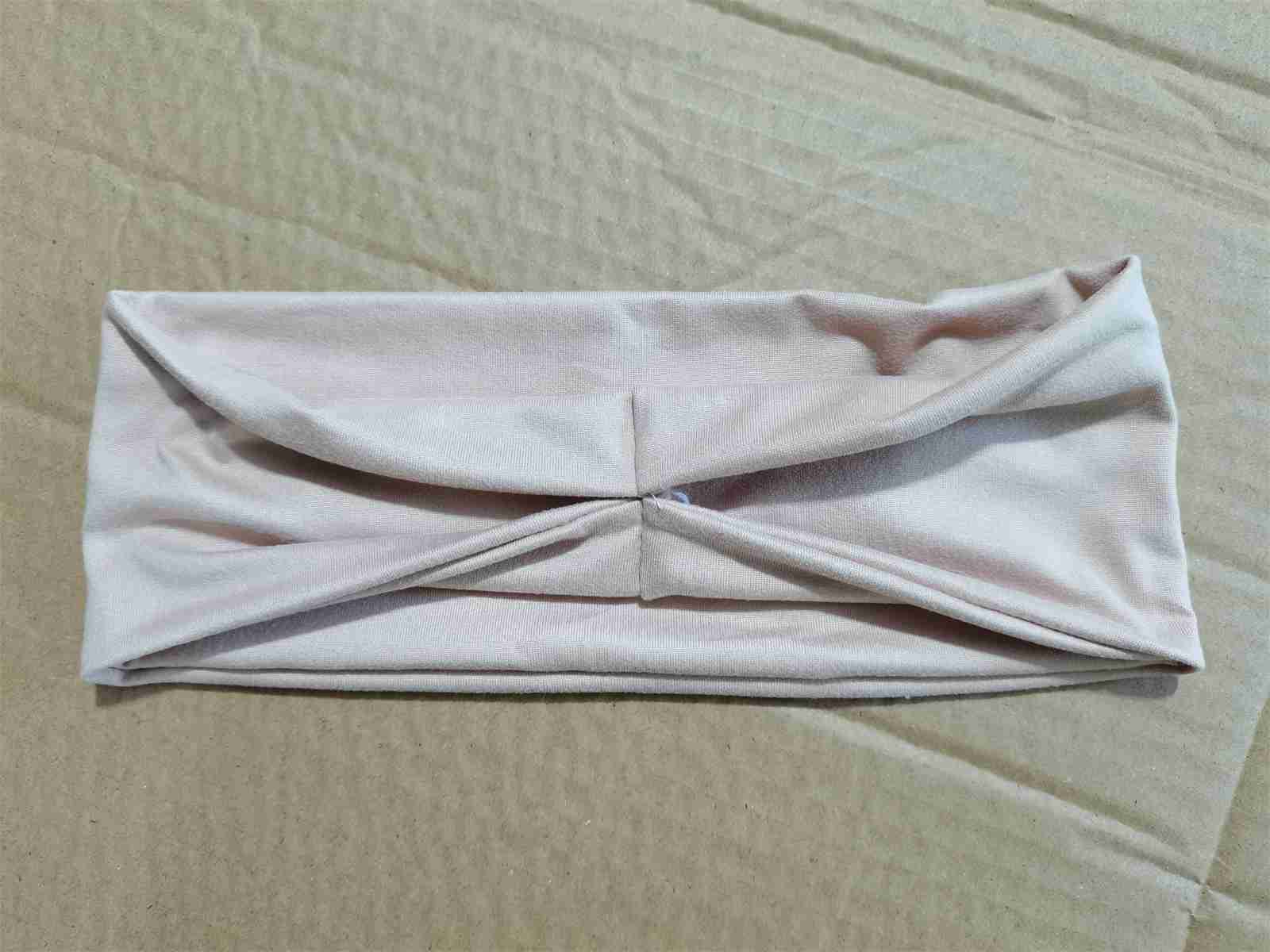 Folded material sample checked during an anonymised pre-shipment inspection in Yiwu