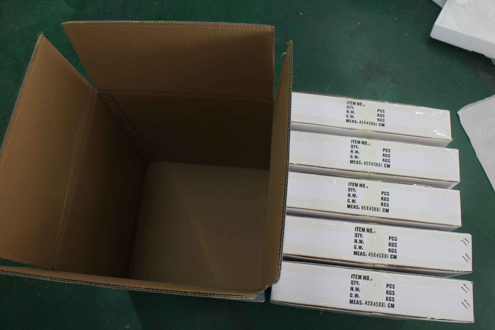 Open shipping carton and packed cartons checked before an Amazon FBA shipment release